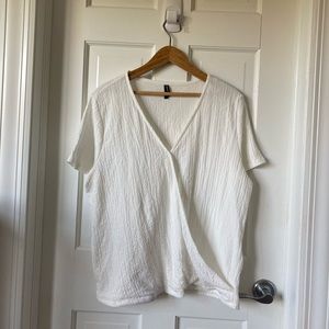 White wraparound short sleeved top